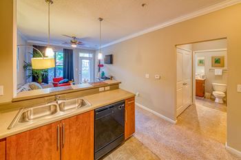 A kitchen with a sink and a window.